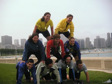 Bikers form a human pyramid in front of the Chicago skyline.