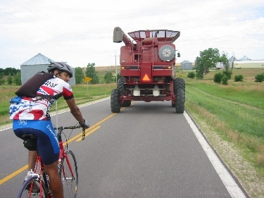 Every biker’s dream—drafting behind a combine. Who’s breaking the wind here?
